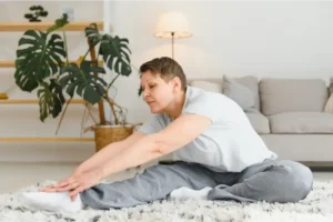 Augusta Pain Center patient stretching to relieve chronic pain.
